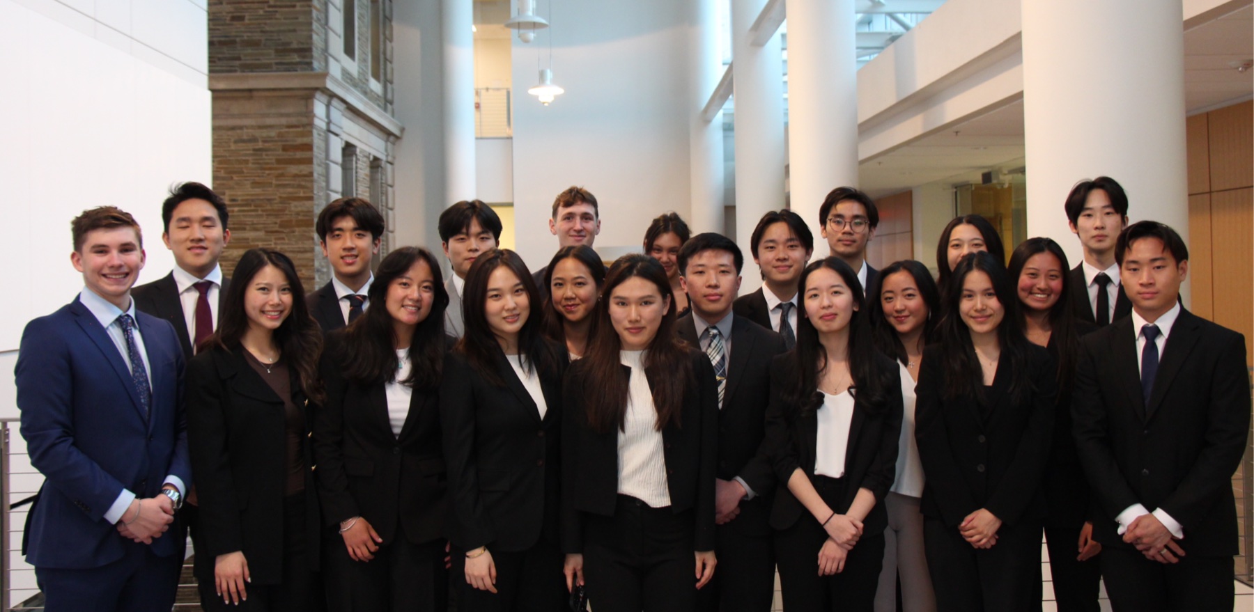 The whole chapter, around twenty members in suits, gathered in a bright atrium
